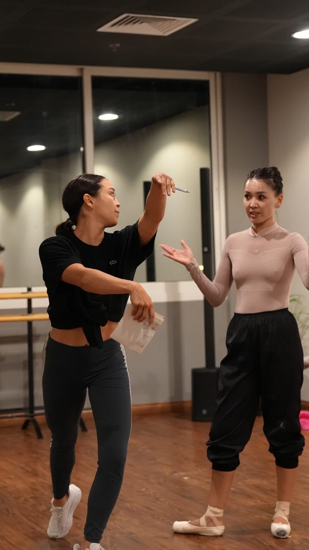 Alina Sultanova directing a dancer in the studio